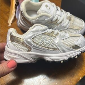 New Balance Kids' White and Metallic Sneakers